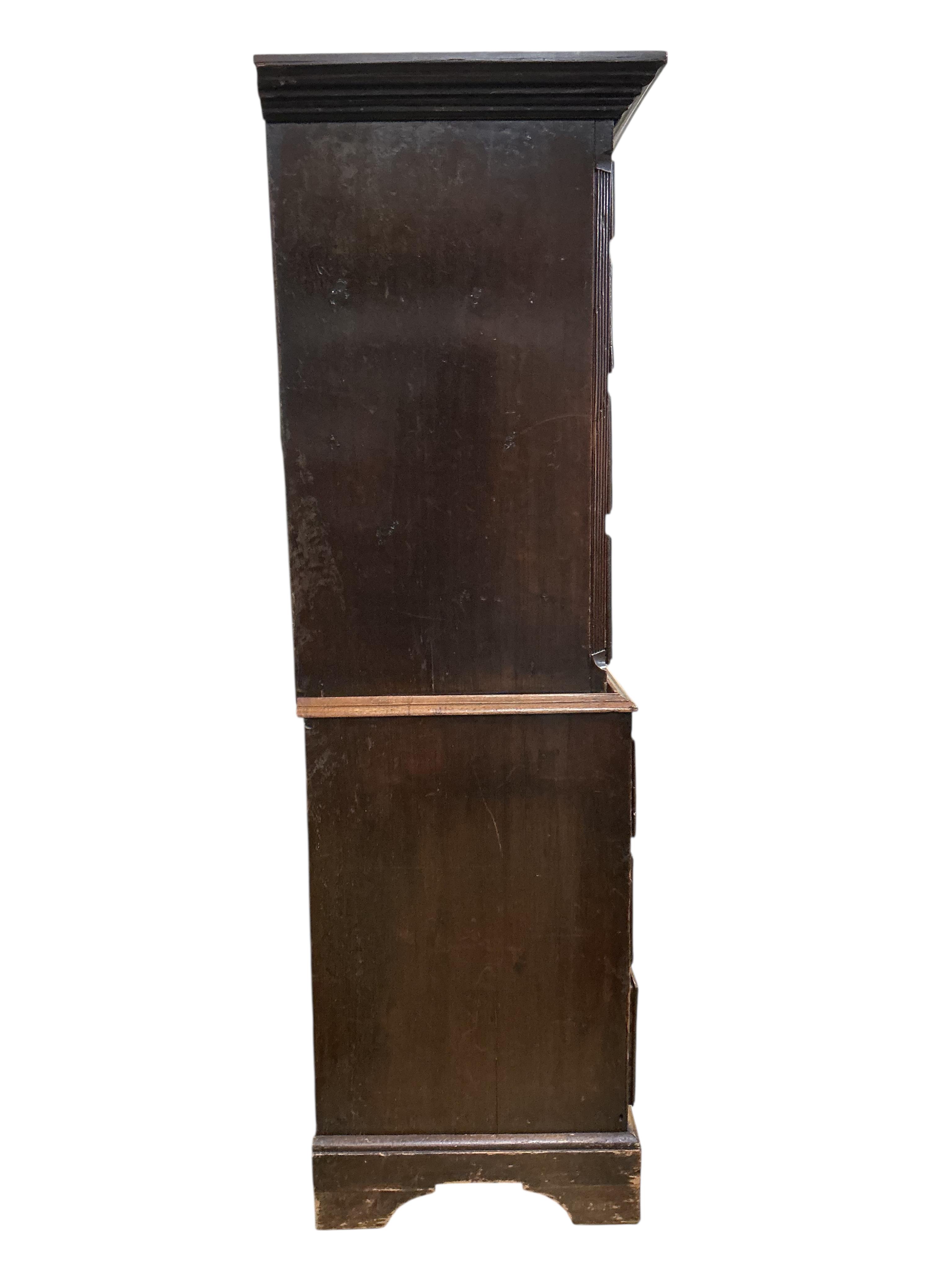 A George III oak chest on chest, width 103cm, depth 56cm, height 191cm